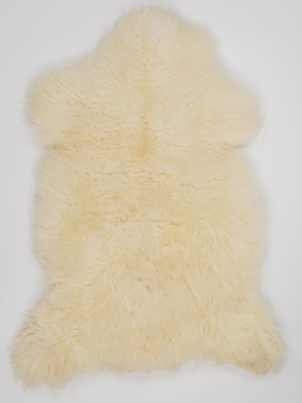 Bílá ovčí kůže L