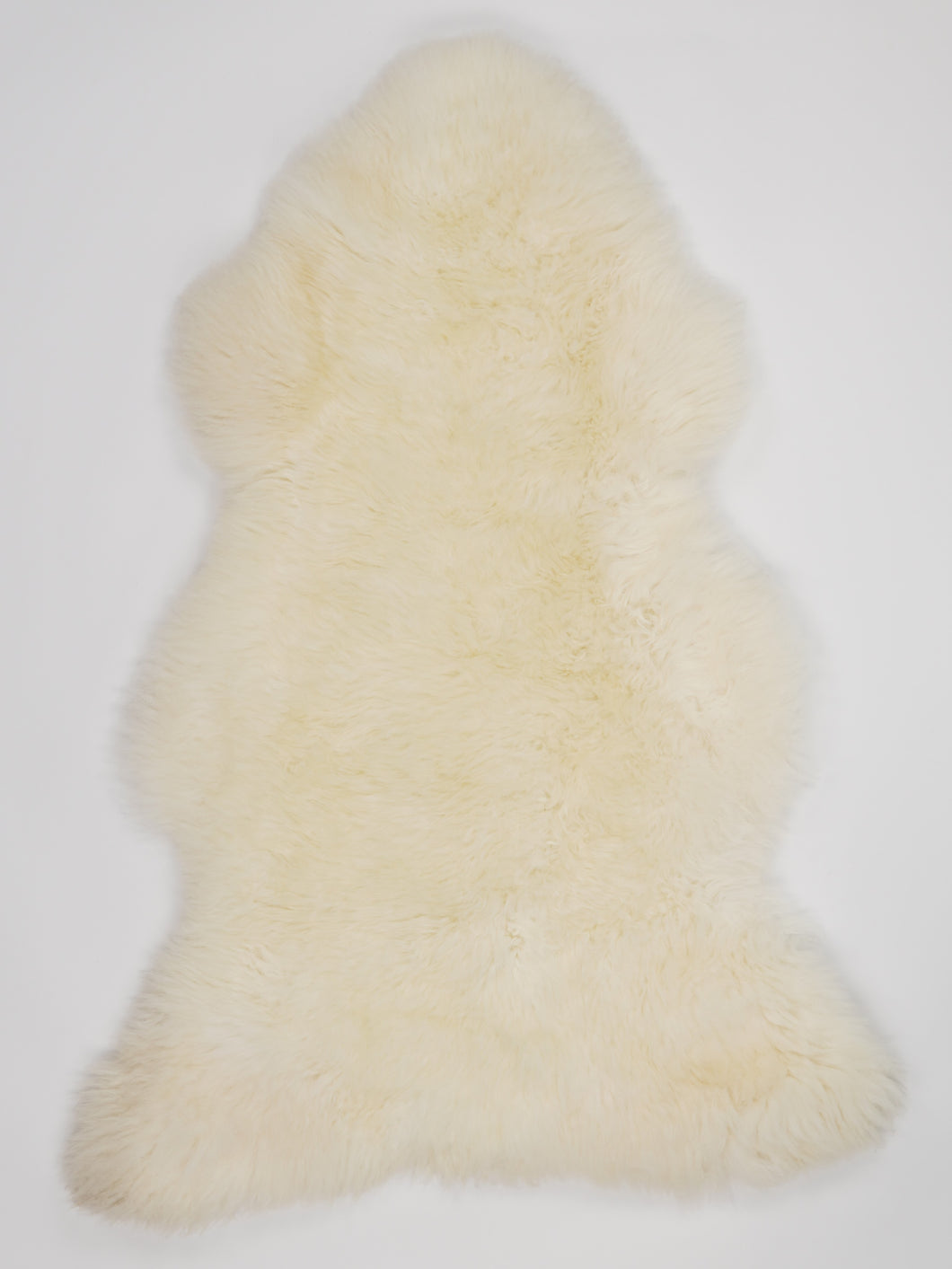 Bílá ovčí kůže L