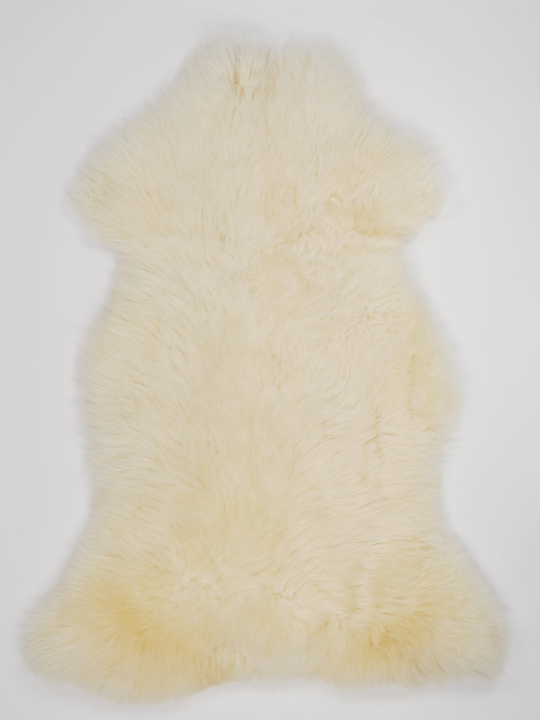 Bílá ovčí kůže L