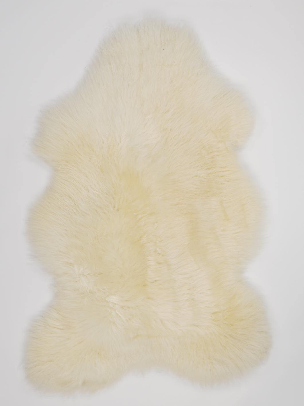 Bílá ovčí kůže L