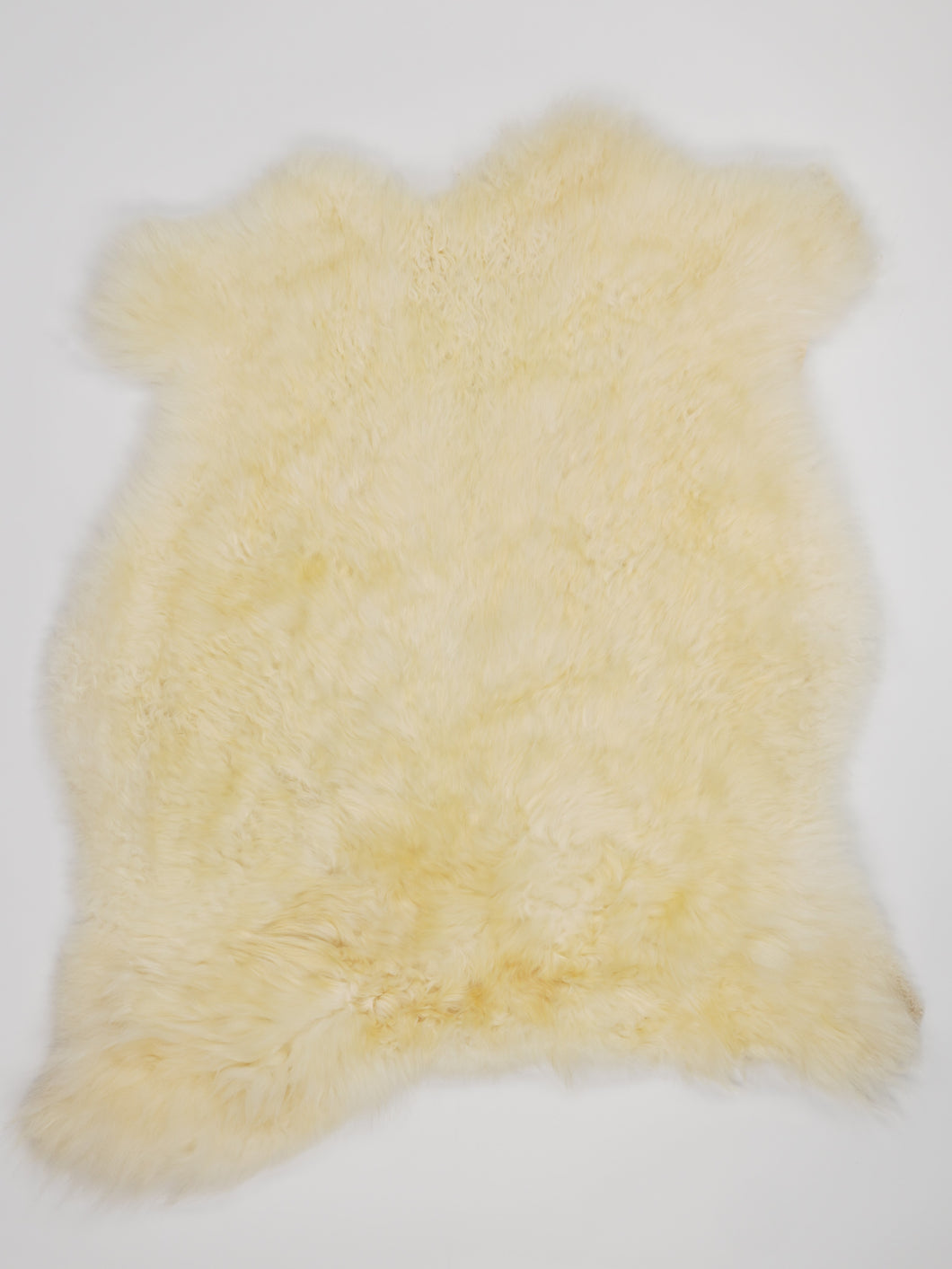 Bílá ovčí kůže L